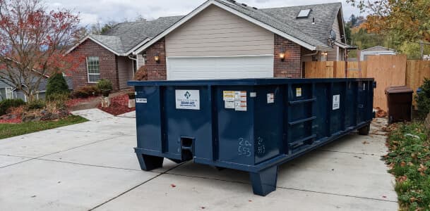 Dumpster rental in front of residential home